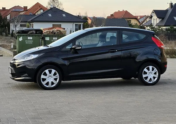 samochody osobowe Ford Fiesta cena 16900 przebieg: 180000, rok produkcji 2009 z Bełchatów